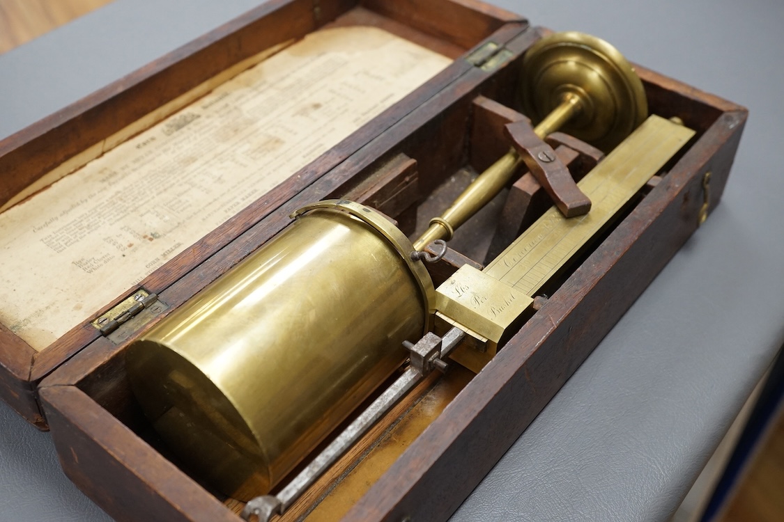 A 19th century mahogany cased brass Corn Balance, made by Bryan Corcoran & Co., 36, Mark Lane, London, with engraved scale and sliding balance marked with; ‘Lbs Per Bushel’, in its original fitted case with paper label t